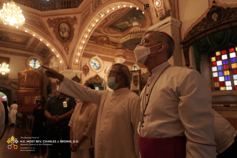 Fr. Raul delos Santos tours Archbishop Brown at the Santiago Apostol Parish in Betis